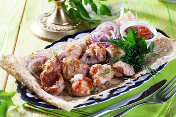 skewers with red onion thin pita bread still life green wooden boards, atmosphere restaurant