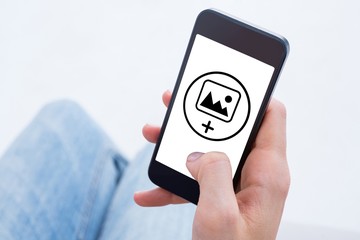 Composite image of woman using her mobile phone