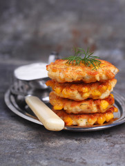 pancakes made ​​from corn and fork on gray background