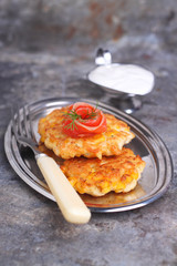 pancakes made ​​from corn and fork on gray background