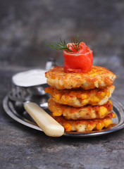 pancakes made ​​from corn and fork on gray background