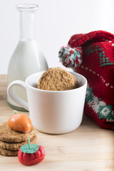 Breakfast with fresh milk, biscuits and candy