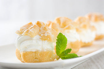 Fresh profiteroles with cream
