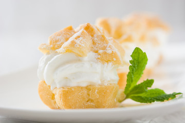 Fresh profiteroles with cream
