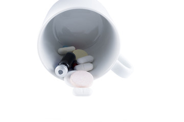 pills and medicines served in a cup