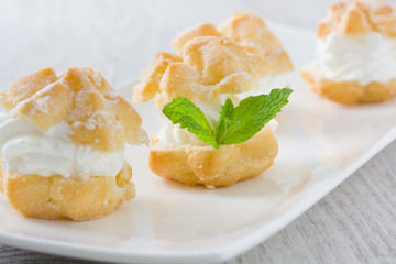 Fresh profiteroles with cream
