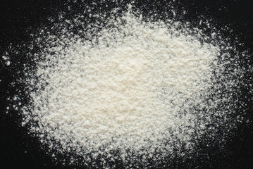 white flour on black background - free space for text