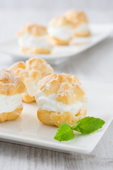 Fresh profiteroles with cream
