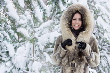 young woman in the winter forest