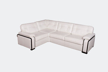 Light leather sofa on a gray background in the studio