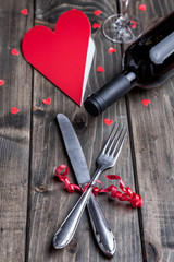 Romantic dinner set on wooden background