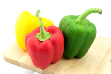 Sweet peppers are dried on a wooden cutting board