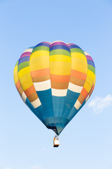 Fototapeta premium Colorful hot air balloon with blue sky background