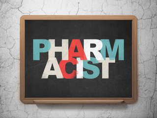 Healthcare concept: Pharmacist on School Board background