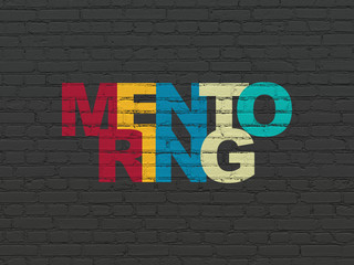 Learning concept: Mentoring on wall background