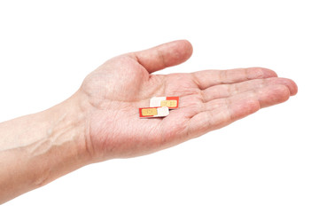 Hand holding a telephone sim card isolated on white