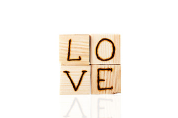 Romantic inscription of letters on light wooden cubes isolated o
