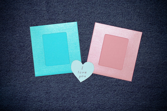 Two photoframes and space for text. Romantic love theme on jeans