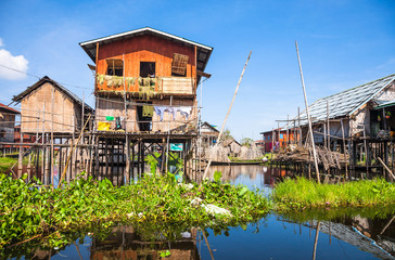 Houses and floating gardens at one of Inle Lake villages on the water in Myanmar.