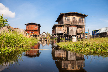 Houses and floating gardens at one of Inle Lake villages on the water in Myanmar.