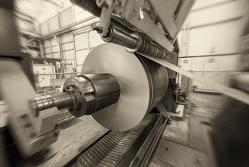 Metal coils machine. Interior of factory. Business concept