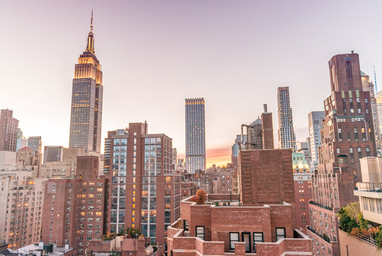 New York skyline from rooftop. Sunset over Manhattan