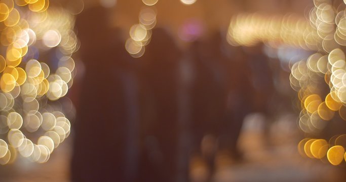 Blurred Lights of Garlands Colorful Lamps People's Silhouettes Square of City is Illuminated at Sofia Square Panorama New Year's Celebration in Kiev