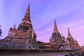 Fototapeta premium Asian religious architecture. Ancient Buddhist pagoda ruins at Wat Phra Sri Sanphet Temple in Ayutthaya, Thailand 