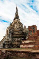 Fototapeta premium Asian religious architecture. Ancient Buddhist pagoda ruins at Wat Phra Sri Sanphet Temple in Ayutthaya, Thailand 