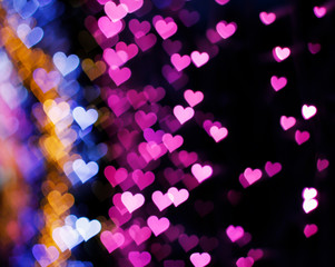 Blurring lights bokeh background of hearts