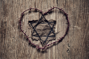 Jewish badge and barbed wire forming a heart