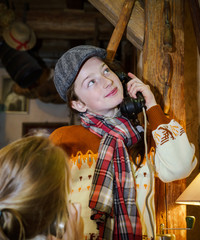 Two sisters playing with old vintage telephon