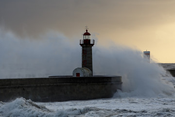 Stormy waves at winter sunset