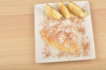 Sweet homemade apple pie with cinnamon and sugar
