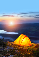 Tent lit up at dusk