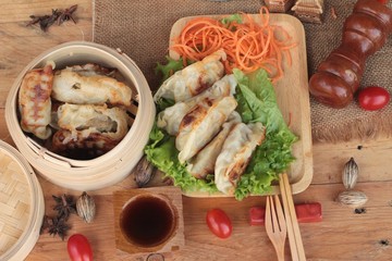 Fried gyoza and sauces - traditional Japanese food.
