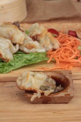 Fried gyoza and sauces - traditional Japanese food.