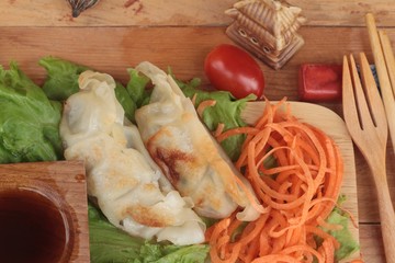 Fried gyoza and sauces - traditional Japanese food.