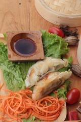 Fried gyoza and sauces - traditional Japanese food.