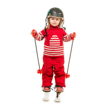 Little Girl In Red Ski Suit Standing On Skis 