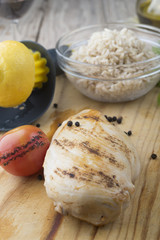 Grilled chicken breast with fresh vegetables .