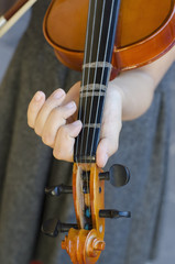 Teenage girl with violin on  gray dress © vasanty