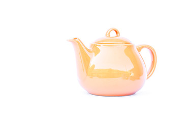 Orange ceramic teapot isolated on white background