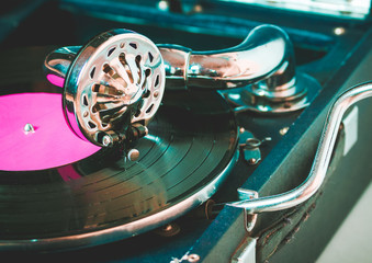 Old record player gramophone needle on record closeup. vintage toning © perfectlab