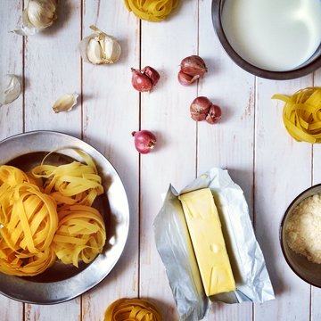 Fresh pasta, butter, garlic, shallots and parmesan cheese to make fettuccine alfredo