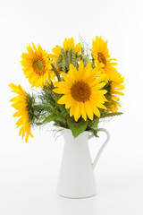 Sunflowers bunch in a metal jug