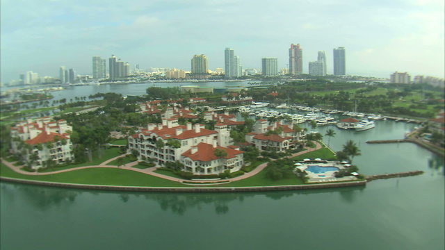 Aerial shot of seaside hotels and a marina in Miami.