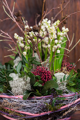 Lily on the valley in handmade basket  decor composition