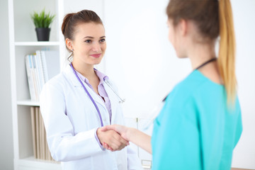 Two doctors handshaking