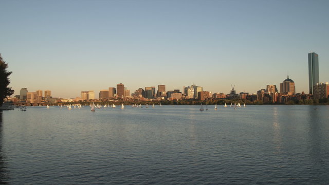 Boston cityscape from across the Charles River at sunset.